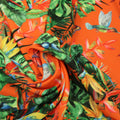 Orange Background with Orange, green and Yellow Leaves and Floral Printed Fabric - Rex Fabrics